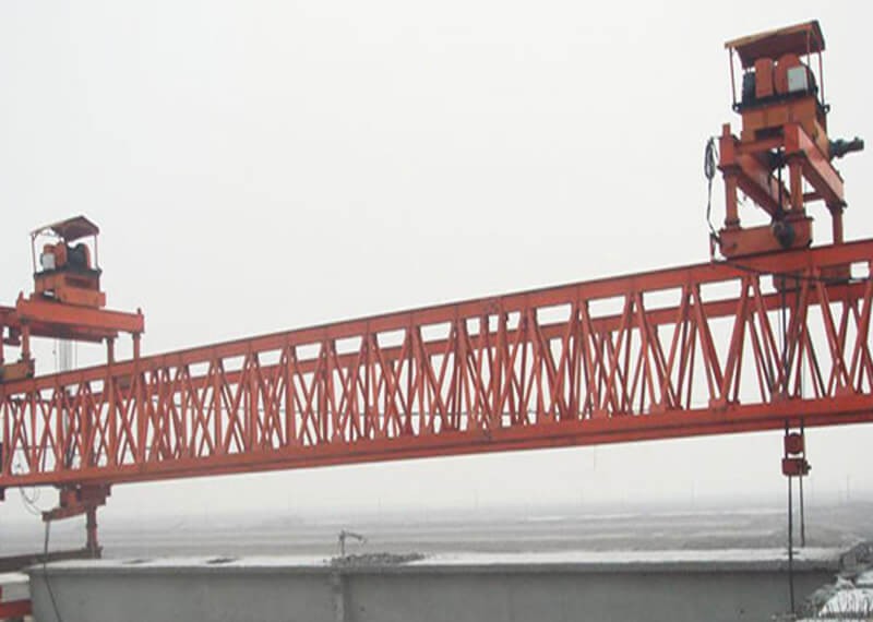 What happens during the use of the bridge girder launcher crane?