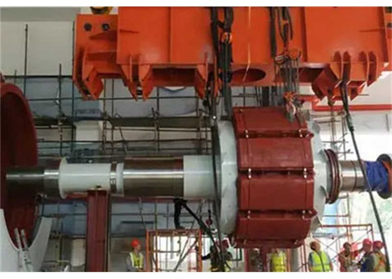 Hydro-generator rotors are hoisted by hand hoist in hydropower station